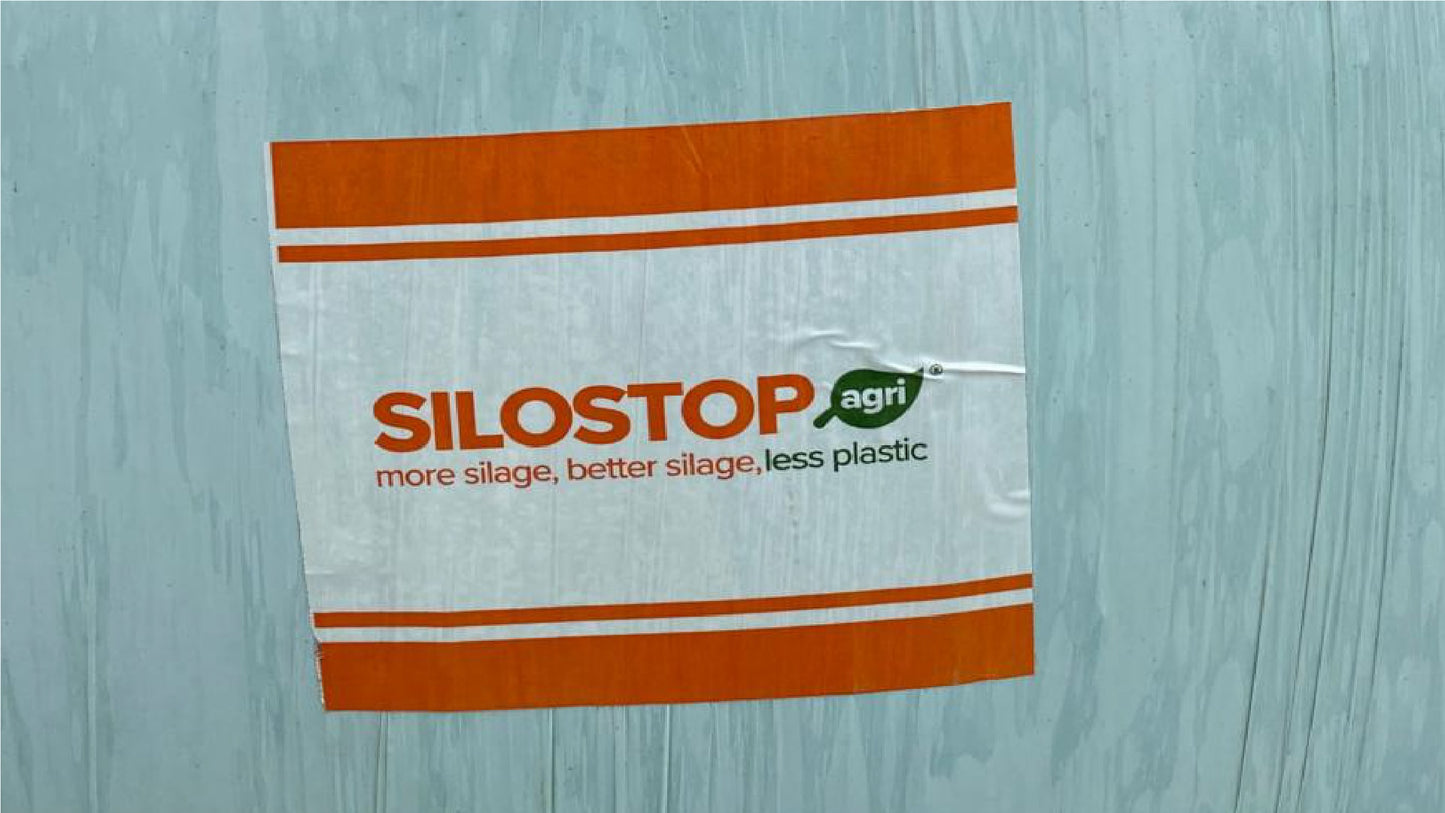 One sheet of Silostop Siloatch stuck to a green bale